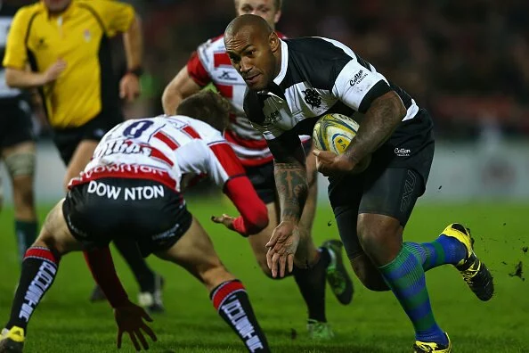 GLOUCESTER, ENGLAND - NOVEMBER 17: Nemani Nadalo of Barbarians carries the ball as Lloyd Evans of Gloucester challenges during the Gloucester v Barbarians match at Kingsholm Stadium on November 17, 2015 in Gloucester, England. (Photo by Michael Steele/Getty Images)