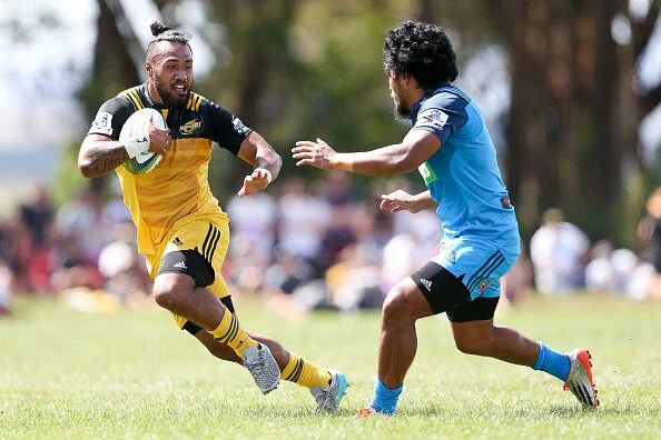 MASTERTON, NEW ZEALAND - FEBRUARY 13: Matt Proctor of the Hurricanes looks to beat the challenge of Matt Vaega of the Blues during the Super Rugby pre-season match between the Blues and the Hurricanes at Eketahuna Rugby Club on February 13, 2016 in Eketahuna, New Zealand. (Photo by Hagen Hopkins/Getty Images)